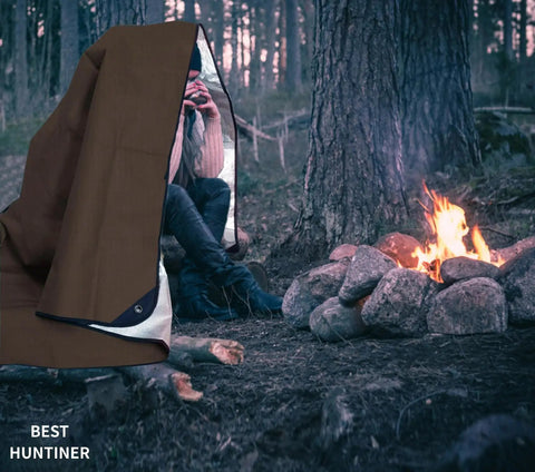 Beefy Heavy Duty Survival Blanket With Reflective Tarp For Camping And Outdoors by a campfire, showcasing thermal use