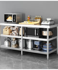 Heavy Duty Three Layer Stainless Steel Workbench Kitchen Countertop Rock Solid Prep Table With Adjustable Legs Reinforced Base Built Tough To Handle Heavy Loads with kitchen appliances.