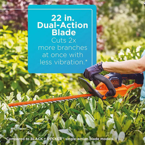 Person using 20V Max Cordless Hedge Trimmer With Power Command Powercut, 22 Inch Dual Action Blade for trimming hedge