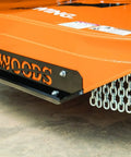 Close-up of rotary cutter base showing metal chains and 'Woods' label, for Replacement Driveline Universal Joint For Rotary Cutter Tiller And Finish Mower Fits 7144RD 9144 9180 9204 Series And Other Tractor Attachments OEM Quality For Heavy Duty Yard Work.