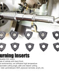 Ten black-coated carbide indexable turning inserts, triangular with central holes, shown with CNC milling machine.