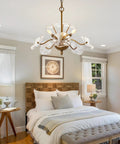 Modern Gold Chandelier Vintage Brass Flower Glass Pendant Light Mid Century Ceiling Lamp over a cozy bedroom setting.