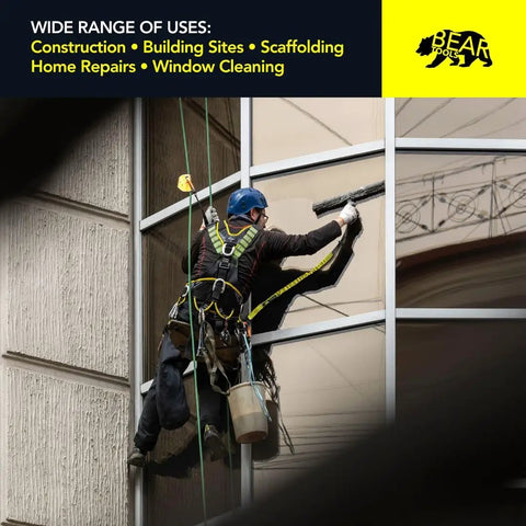 Worker using Heavy Duty Tool Lanyard With Buckle Strap Clip Bungee Cord And Screw Lock Carabiner for window cleaning safety.