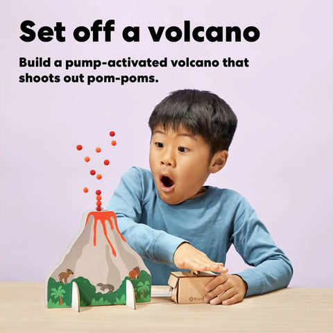 Science Explorer Gift Bundle For Kids 5-9: Geologist, Astronaut And Paleontologist Kits, Hands On STEM Projects, Space And Earth Science Fun, Build, Explore, Dig And Learn. Boy using pump volcano kit with pom-poms.
