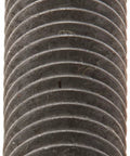 Stack of round zinc-plated steel washers; dark gray metal, front view