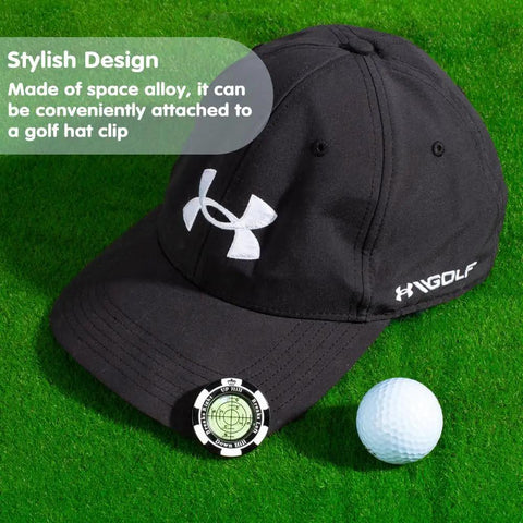 ProGreen Reading Tool on black golf cap with ball marker and golf ball on green