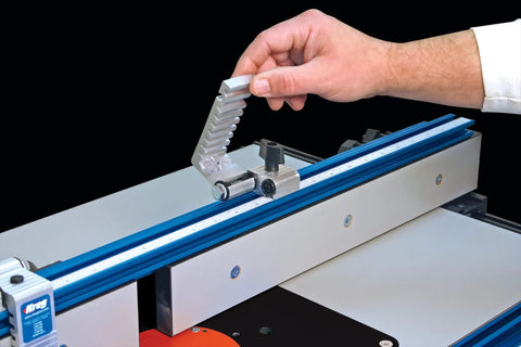 Rock Solid Precision Router Table Stop With Dead Nuts Accurate Lens Cursor And Swift Swing Away Fence Lock positioned on blue rail.