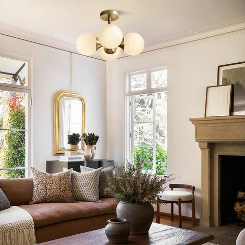 Antique Brass 4 Light Ceiling Light With Frosted Glass Globes, Mid Century Modern Chandelier in cozy living room setting