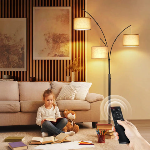 Arc LED Floor Lamp With Remote Control, Dimmable Three Light Arched Tall Lamp in a living room with a child reading