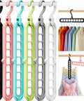 Space Saving Dorm Room Hangers Pack Of 6 With 9 Holes For Wardrobe Organization, multicolor hangers on a rod, showing vertical use.