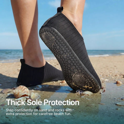 Person wearing Unisex Water Socks For Beach, Kayak, Pool And Travel, Quick-Dry Breathable Fabric With Cushioned Insole on sandy beach