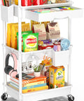 Three Tier Rolling Cart With Removable Drawer And Lockable Wheels For Bathroom Kitchen Office Craft Makeup And Baby Essentials White Space Saver Great For Small Spaces And Daily Use filled with snacks and stationery.