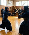 Martial artists training with Set Of 2 Cosplay Swords 47 Inch Handmade Bamboo Practice Props in a dojo setting.