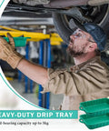 Mechanic using Two-Pack 19.7x15.4x4 Inch Oil Drain Pans, Green 2-Gallon Auto Catch Trays For Under Car Drip.