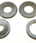 Four Piece Router Table Insert Ring Set Featuring Rock Solid 3.1 Inch Outer Diameter showing four black insert rings closely arranged.