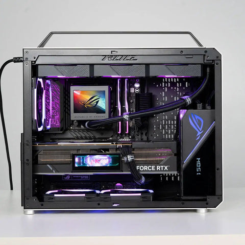 Portable Compact ATX E-ATX Gaming PC Case Silver Built For Gamers On The Go, Modular Layout For ATX E-ATX Boards, Holds 360mm Radiators, 420mm GPUs, 220mm PSUs, 165mm Towers, Multi Zone Fans For Serious Chill. Open silver compact ATX case with handle, RGB hardware, and liquid cooling