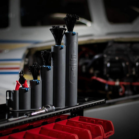 Magnetic Base Cable Tie Organizer With 250 Zip Ties And Cutter in garage with tool cart, showing compact tidy cable management system.