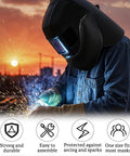 Welder using Two Pack Welding Helmet Cover And Bib Set With Extended Seal For Full Protection Flame Resistant Fabric at sunset