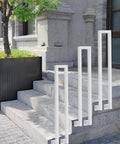 Heavy-Duty U-Shaped Stair Handrail For Indoor Steps, white, installed on gray stone outdoor steps.