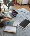 Portable Aluminum Tool Box With Lightweight Alloy Construction on bed beside laptop and documents