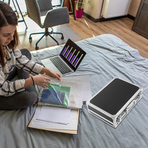 Portable Aluminum Tool Box With Lightweight Alloy Construction on bed beside laptop and documents