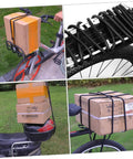 Bicycle loaded with packages secured by Elastic Cargo Binding Belt With Quick Release Tensioner for kayaks and gear.