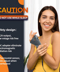 Woman using Electric Thumb And Wrist Heating Pad For Hand Arthritis And Carpal Tunnel Relief with caution and safety info displayed