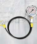 Hydraulic Test Gauge Kit With Three Gauges 0 To 250 Bar 0 To 400 Bar 0 To 600 Bar, depicted with a gauge and black hose, ideal for heavy machinery