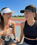 Two women wearing white and black Sun Visor Hat For Women And Men, UV Protection And Breathable Lightweight Foldable Outdoor Headwear.