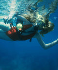 Diver using Mini Scuba Tank 1L For Short Dives, 10-20 Minute Air Tank With Aluminum Cylinder And Valves, in ocean practice.