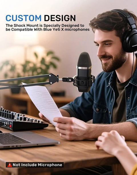 Man using Shock Mount For Yeti X Microphone With 2026 Anti Vibration Suspension Clip on desk setup