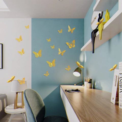 Gold 3D Butterfly Wall Decor Set With 48 Removable Stickers on a blue wall over a modern desk workspace