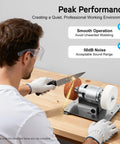Person using the 96W Dual Wheel Benchtop Sander Grinder With Variable Speed Control 3000-6000 RPM Copper Motor for sanding.