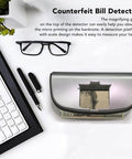 High Speed Money Counter With UV MG WM MGF Detection And Built In Magnifier on desk with keyboard and glasses