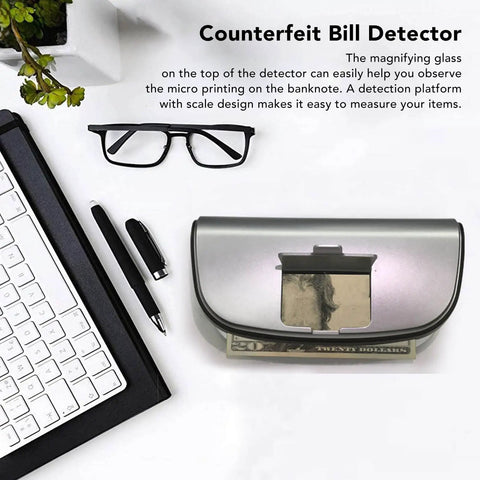 High Speed Money Counter With UV MG WM MGF Detection And Built In Magnifier on desk with keyboard and glasses