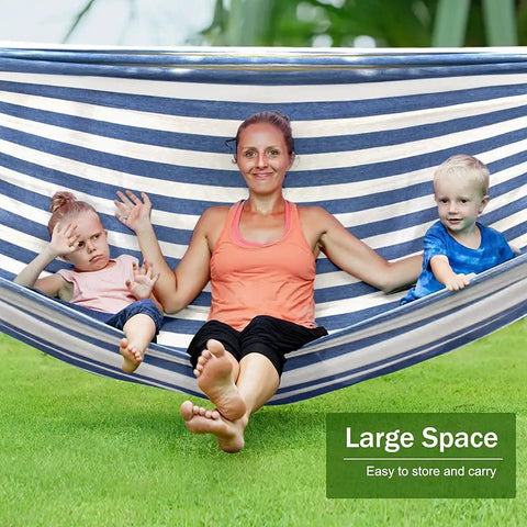 Family relaxing in Built Tough Portable Camping Hammock With 550Lb Capacity, Thick 320G Canvas, blue white striped.