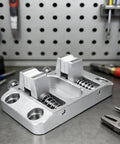 Khbyt Heavy Duty Aluminum Welding Clamp With 4 Strong Magnets And Temp Resistant Jaw on a workbench for secure soldering tasks.