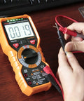 Hands using Pro Grade Digital Multimeter With True RMS AC DC Voltage And Current Measurements 6000 Counts Non Contact Voltage Detector