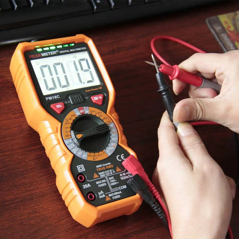 Hands using Pro Grade Digital Multimeter With True RMS AC DC Voltage And Current Measurements 6000 Counts Non Contact Voltage Detector