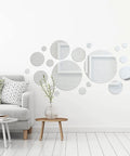32 Piece Removable Acrylic Mirror Wall Stickers Round Tiles Silver Medium Size For Home Bathroom Living Room Bedroom TV Backdrop Dope Decor Easy Peel Self Adhesive No Residue displayed above a sofa