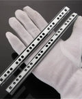 Two Pack 8 To 20 Inch Ball Bearing Drawer Slides For Cabinets And Furniture shown on gloved hand for scale.