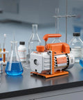VEVOR 3-Gallon vacuum chamber with pump, orange and silver metal unit on lab bench beside glassware.