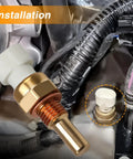 Coolant temperature sensor (ECT) with brass threaded probe and white plastic connector, automotive part