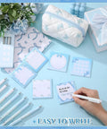 Hand writing on sticky note with Blue Bow Stationery Set For School And Office Dope A5 Notebook 12 Smooth Gel Pens 6 Sticky Notes Pencil Pouch