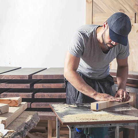 Craftsman in workshop working on wood pieces with Pattern Flush Trim Router Bit Set With Top Bearing, 4 Pc Kit for veneer edging.