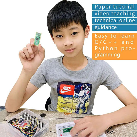 Boy holding Raspberry Pi Pico Starter Kit With Breadboard I2C 1602 LCD Display Module And 9g Micro Servo for hands-on projects.