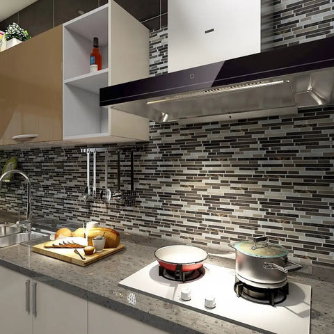 Modern kitchen with Self Adhesive Peel And Stick 12x12 Inch Wall Tiles, shiny backsplash, gas stove, and kitchen items.