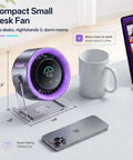 USB Desk Fan For Bedroom And Office With 100 Speed Digital Display on desk, compact size, with phone and cup, purple LED ring