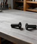 Grab These 45 Pack Black Steel Cable Railing Protector Sleeves For Durable Wood Posts. Top Quality Resistant Guards With Drill Bit Hardware Kit Included To Install Your Outdoor Deck Fast And Easy Today. Black steel cable railing protector sleeves on wood post surface