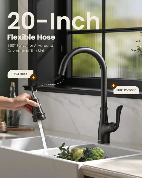 Oil Rubbed Bronze Pull Down Kitchen Faucet With Sprayer, Antique ORB Finish, Single Handle High Arc, in use over sink.